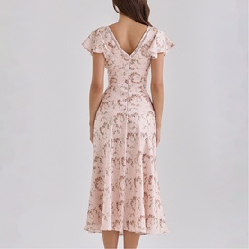 Model wearing House of CB Vintage Rose Floral midi dress with flutter sleeves, V-back neckline and flared skirt