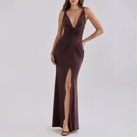 Model wearing House of CB Black Cherry maxi dress with deep V-neck, ruched bodice, spaghetti straps and thigh-high split
