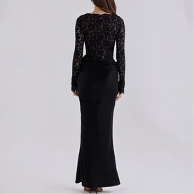 Model wearing House of CB black lace long-sleeve maxi dress with fitted bodice and flared skirt, shown from the back