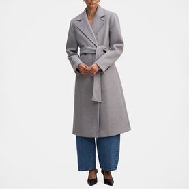 Model wearing Forever New Grey Marle belted wrap coat, styled with wide-leg blue jeans and black heels.