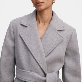 Model wearing Forever New Grey Marle wrap coat with wide lapels and self-tie belt, close-up detail shot.