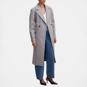 Model wearing Forever New Grey Marle longline double-breasted coat, styled with blue wide-leg jeans and black heels.