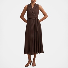 Model wearing Forever New Chocolate Freckle sleeveless pleated midi dress with tie waist and lapel collar, styled with tan heeled sandals