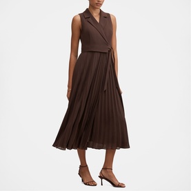 Model wearing Forever New Chocolate Freckle pleated midi dress with wrap bodice, styled with brown strappy heeled sandals