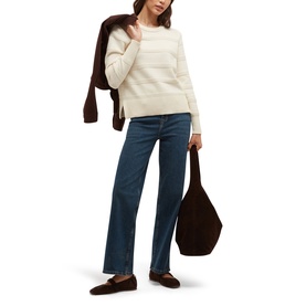 Model wearing Hobbs warm ivory striped knit jumper with wide-leg blue jeans and dark loafers, brown jacket draped over shoulder