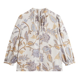 Hobbs blue multi floral print blouse with tie neckline, long puffed sleeves, and ditsy botanical pattern on cream ground
