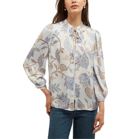 Model wearing Hobbs blue multi floral print blouse with tie neck, blouson sleeves, styled with blue jeans