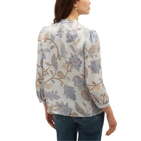 Model wearing Hobbs blue multi floral print blouse with three-quarter sleeves, styled with blue jeans, seen from behind.