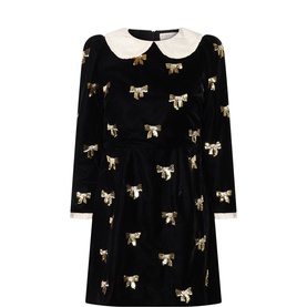 Queens of Archive dress in black velvet with allover gold sequin bow print, cream lace Peter Pan collar, and long sleeves