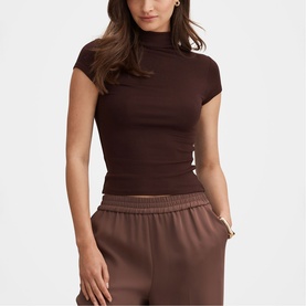 Model wearing Forever New chocolate mock-neck cap sleeve fitted top, styled with matching brown wide-leg trousers.