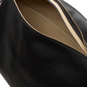 Wandler black crust leather tote bag, open top view showing gold zip and beige interior lining