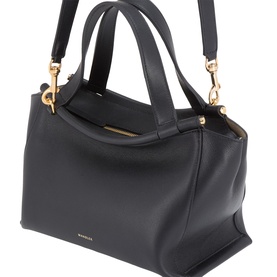 Black structured leather tote bag with twin top handles, detachable shoulder strap, and gold-tone hardware clasps