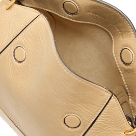 Wandler Sand Glaze calf leather shoulder bag interior, showing smooth beige lining and gold-tone press stud detailing