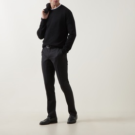 Model wearing Zegna black cashmere-silk polo knitwear, styled with dark grey trousers, black belt and loafers.
