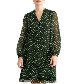 Model wearing Phase Eight green polka dot chiffon mini dress with V-neckline, tiered skirt, and sheer long sleeves