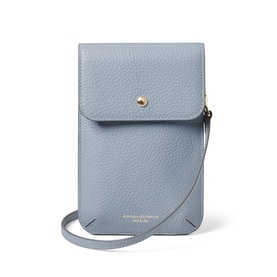 Aspinal of London Sky Blue pebbled leather phone crossbody bag with gold snap closure and thin adjustable strap.