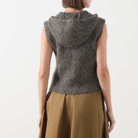 Model wearing Max Mara Studio Gela Zip Knitted Vest in kaki, chunky-knit sleeveless design with hood, shown from behind over an olive skirt.