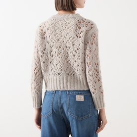 Model wearing Max Mara Studio Ladino Open-Knit Sweater in Natural, open-knit back detail, long sleeves, styled with blue jeans