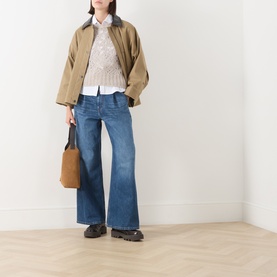 Model wearing Max Mara Studio Ladino Open-Knit Sweater in Natural, styled with a white shirt, wide-leg jeans, tan jacket and brown loafers