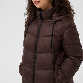 Model wearing Kaffe Coffee Bean quilted puffer jacket with hood and zip fastening, styled close up showing chest and shoulder detail.