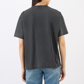 Model wearing Anine Bing black cotton T-shirt, rear view, styled with blue jeans.