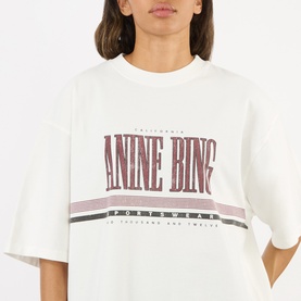 Model wearing Anine Bing white oversized cotton T-shirt with burgundy and grey logo graphic print to chest