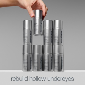 Dermalogica Eye Serum cylinders stacked in pyramid formation with text reading rebuild hollow undereyes