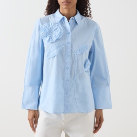 Model wearing Fabienne Chapot Alex 3D Floral Appliqu&eacute; Blouse in Icey Blue with 3D floral detail, wide cuffs, styled with white trousers