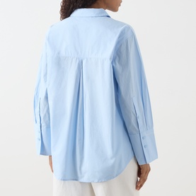 Model wearing Fabienne Chapot Alex 3D Floral Appliqu&eacute; Blouse in Icey Blue, rear view showing box pleat, wide cuffs and curved hem