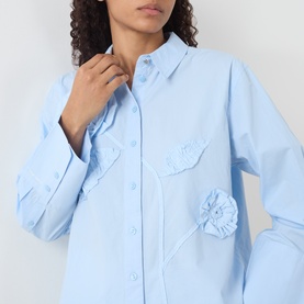 Model wearing Fabienne Chapot Alex 3D Floral Appliqu&eacute; Blouse in Icey Blue cotton with classic collar and chest floral detail.