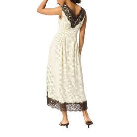 Model wearing Whistles midi dress in cream with dark polka dots, lace trim neckline and hem, styled with black heeled mules