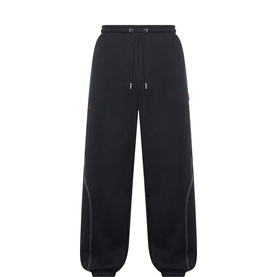 Pellador black cotton sweatpants with elasticated drawstring waist, wide leg silhouette, and contrast stitching detail