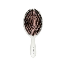 The Belle Brush The Signature Brush, oval paddle hairbrush in white with natural bristles and cushioned base