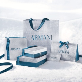 Armani Beauty Stronger With You Intensely Gift Set displayed in teal and silver gift boxes, bag and card arranged in snow