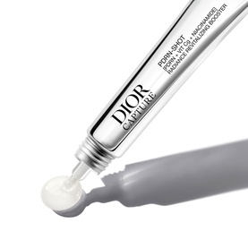 Dior Capture Youth Niacinamide Radiance Booster serum tube with open applicator tip dispensing white cream