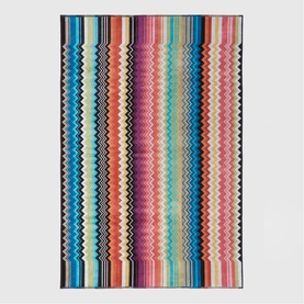 Missoni Bath Towelling in multicolour zigzag stripe pattern, featuring vibrant pink, orange, blue and cream tones with dark border.
