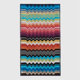 Missoni Bath Towel in multicolour zigzag stripe pattern, featuring bold chevron design in red, blue, orange, black and white tones.