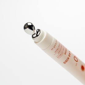 Solas Skin lip sun care tube with silver roller-ball applicator tip, white packaging with red text detail