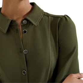 Phase Eight green dress close-up showing pointed collar, silver button-through front, and contrast topstitching detail