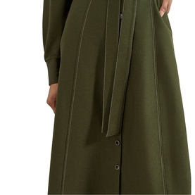 Model wearing Phase Eight green midi dress with contrast stitching, tie detail at waist and snap button hem, long sleeves