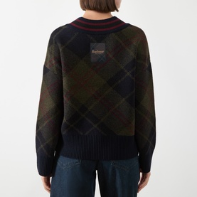 Model wearing Barbour Shadow Classic Tartan wool-blend sweater, back view, with striped ribbed collar and logo patch.