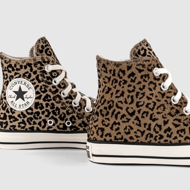 Converse Chuck Taylor All Star high-top trainers in leopard egret print, white rubber sole and laces, star ankle patch detail