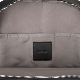 Calvin Klein black backpack interior showing grey fabric lining and black branded leather patch label