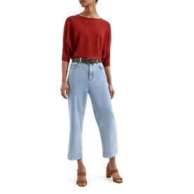Model wearing Phase Eight brown knit top with cropped wide-leg light blue jeans, black belt, and tan block-heel mules