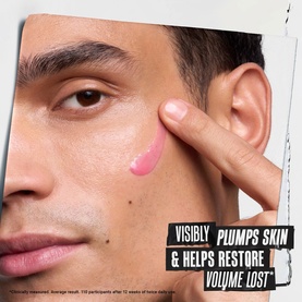 Kiehl's Collagen Serum swatched on model's cheek, showing pink gel texture, with on-pack claim visibly plumps skin and restores volume lost.
