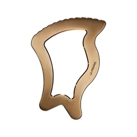 La Prairie gold-tone facial gua sha sculpting tool with ergonomic contoured shape and engraved logo