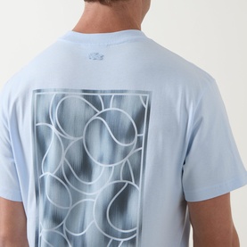 Model wearing Lacoste Crew Neck T in Rill blue, back view showing large tonal abstract circle graphic print