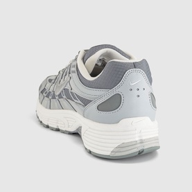 Nike P-6000 trainer in grey and silver mesh with white chunky sole, rear three-quarter view