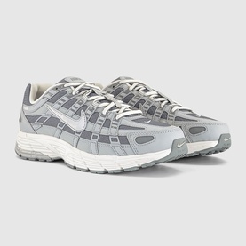 Nike P-6000 trainers in grey and white colourway, mixed material upper with mesh panels, white midsole and rubber outsole