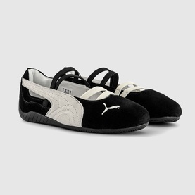 Puma black velvet Mary Jane flats with white suede panel, embroidered cat logo, and elasticated ankle strap